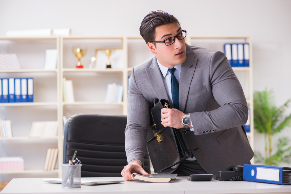 Employee stealing from desk in office