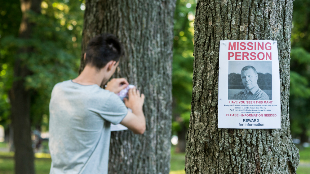 Misisng person poster on tree